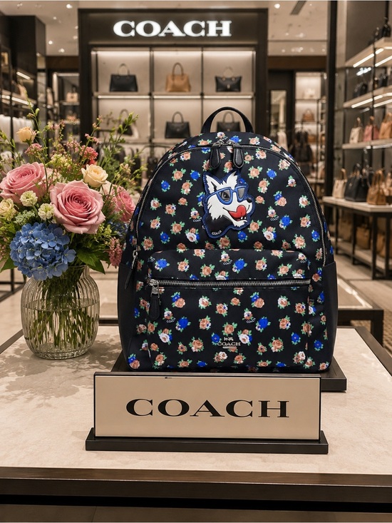 Coach Handbags - Coach Charlie Backpack in Tea Rose Floral Print Nylon with a dog patch.